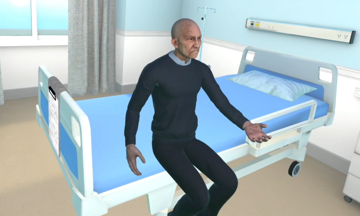 Virtual patient seated beside a hospital bed in a clinical scenario